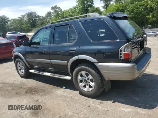 2003 Isuzu Rodeo z VIN 4S2CK58W734311374, wystawiony jako Copart lot #57949325 z przebiegiem 247 580 mil mil oraz Tytuł czysty. Historia ofert i sprzedaży dostępna na DreamBid. Obrazek 2.
