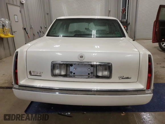1994 Cadillac DeVille z VIN 1G6KD52B7RU290139, wystawiony jako Copart lot #46899465 z przebiegiem 133 110 mil mil oraz Czysty tytuł • Clean title. Historia ofert i sprzedaży dostępna na DreamBid. Obrazek 6.