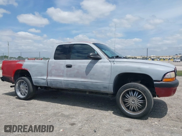 2002 Dodge Dakota Sport with VIN 1B7GL32X82S632091, listed as a IAAI auction lot 42091290 with 206,721 mi miles and . Bid and sale history available at carsss.com. Image 14.