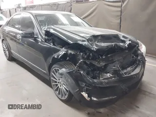 2014 Mercedes-Benz C C 250 Sport with VIN WDDGF4HB9EA954859, listed as a IAAI auction lot 42027885 with 64,223 mi miles. Bid and sale history available at carsss.com. Image 1.