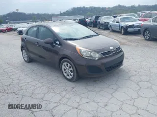 2013 Kia Rio EX with VIN KNADN5A3XD6203745, listed as a IAAI auction lot 41781006 with 165,000 mi miles. Bid and sale history available at carsss.com. Image 1.