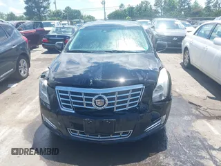 2013 Cadillac XTS Luxury z VIN 2G61P5S37D9101989, wystawiony jako IAAI lot #42242641 z przebiegiem 243 006 mil mil oraz . Historia ofert i sprzedaży dostępna na DreamBid. Obrazek 6.