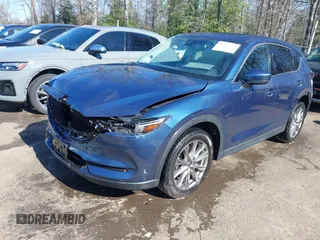 2020 Mazda CX-5 Grand Touring with VIN JM3KFBDM9L0756826, listed as a IAAI auction lot 41866290 with 145,567 mi miles. Bid and sale history available at carsss.com. Image 2.