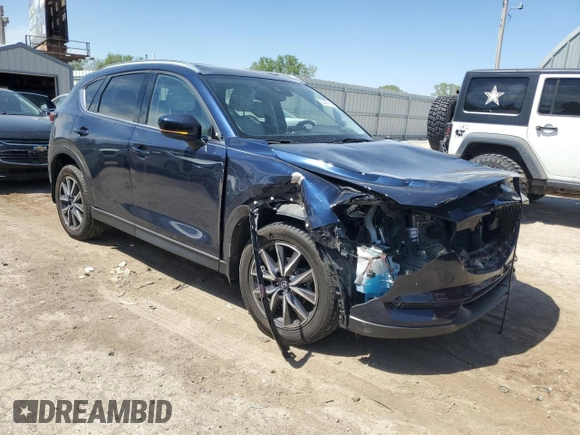 2018 Mazda CX-5 Grand Touring with VIN JM3KFADM7J0377315, listed as a Copart auction lot 53335185 with 68,462 mi miles and Salvage title. Bid and sale history available at DreamBid. Image 4.