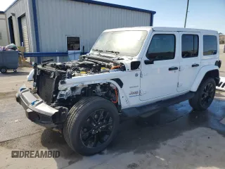 2023 Jeep Wrangler Sahara with VIN 1C4JJXP69PW525201, listed as a Copart auction lot 43516985 with 34,769 mi miles and Salvage Title. Bid and sale history available at DreamBid. Image 1.