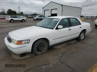 1999 Mercury Grand Marquis LS z VIN 2MEFM75W6XX619412, wystawiony jako Copart lot #51939515 z przebiegiem 131 784 mil mil oraz Szkoda całkowita • Salvage title. Historia ofert i sprzedaży dostępna na DreamBid. Obrazek 1.
