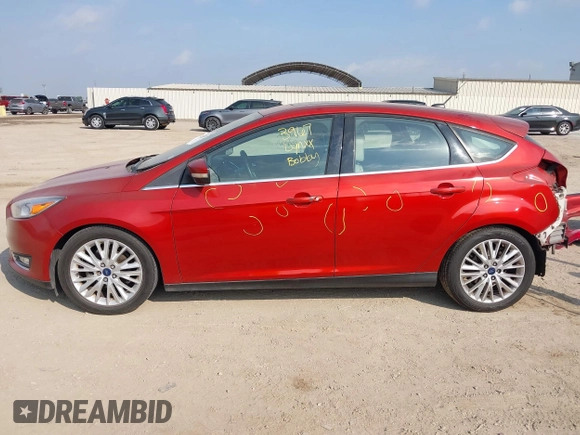 2018 Ford Focus Titanium z VIN 1FADP3N24JL313938, wystawiony jako IAAI lot #42050701 z przebiegiem 162 859 mil mil oraz . Historia ofert i sprzedaży dostępna na DreamBid. Obrazek 15.
