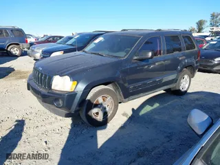 2006 Jeep Grand Cherokee Laredo with VIN 1J8GS48K86C348389, listed as a IAAI auction lot 41187321 with 166,275 mi miles. Bid and sale history available at carsss.com. Image 2.