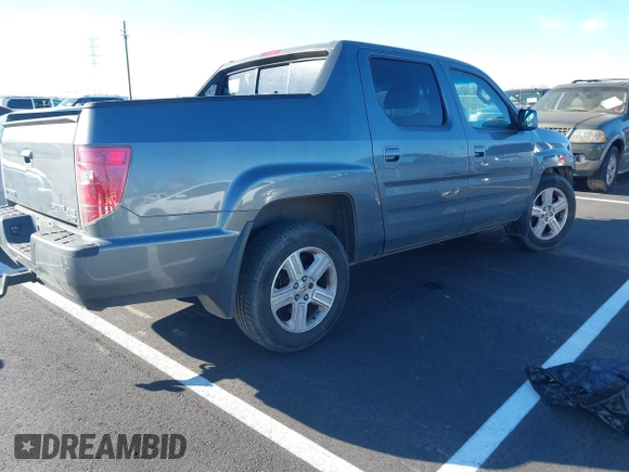 2009 Honda Ridgeline RTL with VIN 2HJYK16589H502832, listed as a IAAI auction lot 41878496 with 101,695 mi miles and . Bid and sale history available at DreamBid. Image 4.