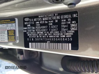 2013 Kia Sorento LX z VIN 5XYKT3A6XDG408459, wystawiony jako Copart lot #52556785 z przebiegiem 195 680 mil mil oraz Szkoda całkowita • Salvage title. Historia ofert i sprzedaży dostępna na DreamBid. Obrazek 14.