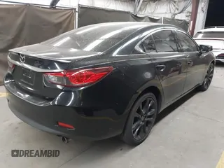 2014 Mazda Mazda6 i Touring with VIN JM1GJ1T67E1125290, listed as a IAAI auction lot 42041112 with 114,875 mi miles. Bid and sale history available at carsss.com. Image 4.