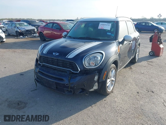 2013 MINI Countryman S ALL4 with VIN WMWZC5C58DWP33707, listed as a IAAI auction lot 41835234 with 98,441 mi miles and . Bid and sale history available at DreamBid. Image 2.