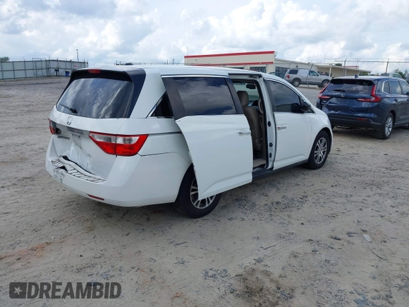2011 Honda Odyssey EX-L with VIN 5FNRL5H67BB011070, listed as a IAAI auction lot 42491685 with 200,671 mi miles and . Bid and sale history available at DreamBid. Image 4.
