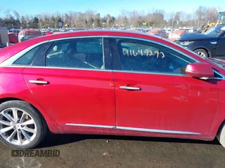 2014 Cadillac XTS Luxury z VIN 2G61N5S34E9163874, wystawiony jako IAAI lot #41649292 z przebiegiem 104 638 mil mil oraz . Historia ofert i sprzedaży dostępna na DreamBid. Obrazek 13.
