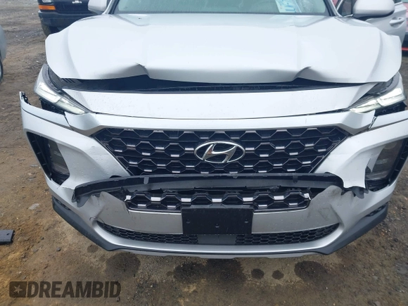 2019 Hyundai Santa Fe SE z VIN 5NMS23AD4KH130517, wystawiony jako IAAI lot #42324854 z przebiegiem 76 963 mil mil oraz . Historia ofert i sprzedaży dostępna na DreamBid. Obrazek 6.