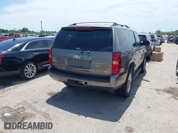 2011 Chevrolet Tahoe LS with VIN 1GNSCAE00BR343816, listed as a IAAI auction lot 42363718 with 253,212 mi miles and . Bid and sale history available at DreamBid. Image 4.