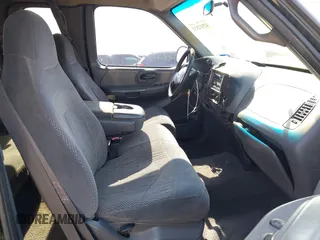 1999 Ford F-150 XL with VIN 1FTRX18L3XKA77743, listed as a IAAI auction lot 42512532 with Not provided miles and . Bid and sale history available at DreamBid. Image 5.