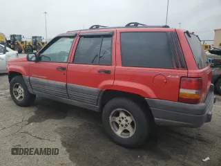 1996 Jeep Grand Cherokee Laredo with VIN 1J4GZ58S7TC292217, listed as a Copart auction lot 80757904 with 156,041 mi miles and Salvage Title. Bid and sale history available at carsss.com. Image 2.