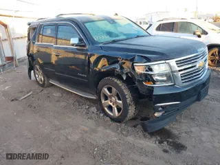 2015 Chevrolet Tahoe LTZ with VIN 1GNSKCKC2FR106098, listed as a IAAI auction lot 41031110 with 167,172 mi miles. Bid and sale history available at carsss.com. Image 1.