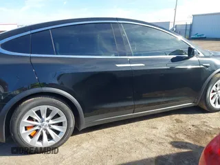 2018 Tesla Model X 75D with VIN 5YJXCDE44JF091690, listed as a IAAI auction lot 41585617 with 128,826 mi miles and . Bid and sale history available at DreamBid. Image 13.