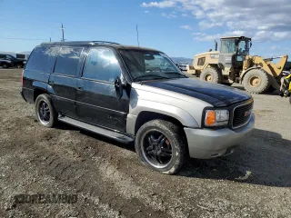 2000 GMC Denali z VIN 1GKEK13R8YR109690, wystawiony jako Copart lot #76165584 z przebiegiem 153 366 mil mil oraz Szkody całkowita. Historia ofert i sprzedaży dostępna na DreamBid. Obrazek 4.