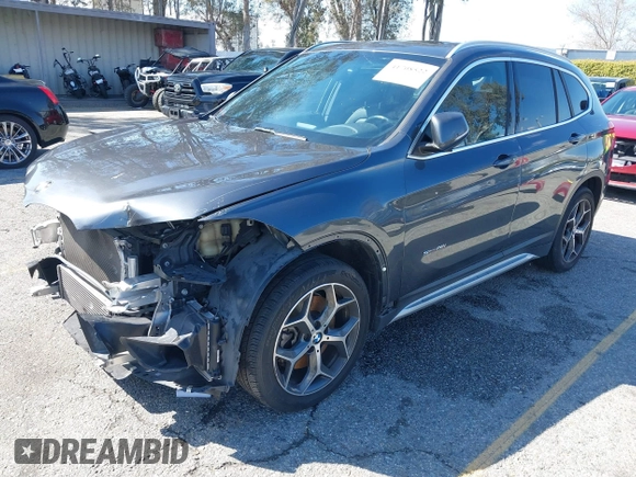 2018 BMW X1 sDrive28i with VIN WBXHU7C36J5L05628, listed as a IAAI auction lot 41708522 with 91,352 mi miles and . Bid and sale history available at DreamBid. Image 2.