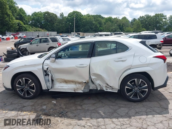 2022 Lexus UX 200 z VIN JTHP3JBH8N2055563, wystawiony jako IAAI lot #42462891 z przebiegiem 25 828 mil mil oraz . Historia ofert i sprzedaży dostępna na DreamBid. Obrazek 14.