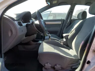 2004 Suzuki Forenza S z VIN KL5JD52Z14K950658, wystawiony jako Copart lot #74824154 z przebiegiem 99 150 mil mil oraz Tytuł czysty. Historia ofert i sprzedaży dostępna na DreamBid. Obrazek 7.