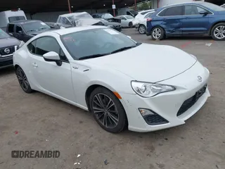 2015 Scion FR-S z VIN JF1ZNAA13F8700018, wystawiony jako IAAI lot #41557710 z przebiegiem 73 010 mil mil oraz . Historia ofert i sprzedaży dostępna na DreamBid. Obrazek 1.