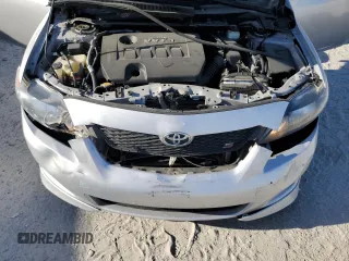 2010 Toyota Corolla z VIN 1NXBU4EE2AZ281538, wystawiony jako Copart lot #54864765 z przebiegiem 157 326 mil mil oraz Szkoda całkowita • Salvage title. Historia ofert i sprzedaży dostępna na DreamBid. Obrazek 11.
