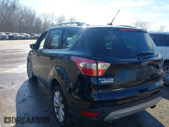 2017 Ford Escape Titanium with VIN 1FMCU0J94HUD58815, listed as a IAAI auction lot 41455415 with 80,421 mi miles and . Bid and sale history available at DreamBid. Image 3.