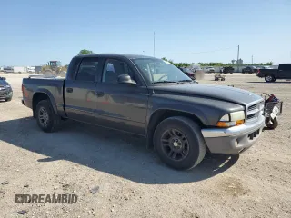 2003 Dodge Dakota SLT with VIN 1D7HL48X03S114761, listed as a Copart auction lot 52323405 with 137,105 mi miles and Salvage Title. Bid and sale history available at carsss.com. Image 4.