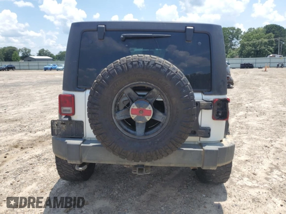 2015 Jeep Wrangler Unlimited Rubicon with VIN 1C4BJWFG6FL710993, listed as a Copart auction lot 62308195 with 103,938 mi miles and Salvage title. Bid and sale history available at DreamBid. Image 6.