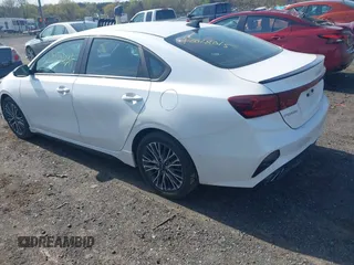 2023 Kia Forte GT-Line with VIN 3KPF54AD5PE563311, listed as a IAAI auction lot 42028015 with 54,900 mi miles. Bid and sale history available at carsss.com. Image 3.