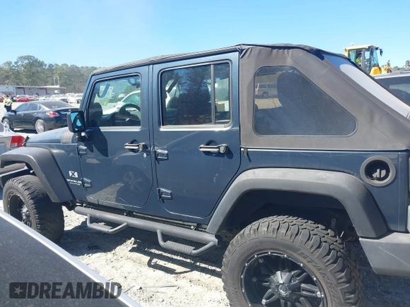 2008 Jeep Wrangler Unlimited X with VIN 1J4GB39138L589300, listed as a IAAI auction lot 41671690 with Not Provided miles and . Bid and sale history available at DreamBid. Image 14.