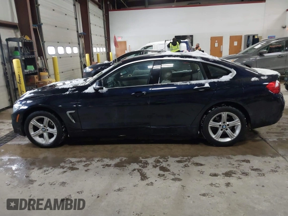 2015 BMW 4 Series 428i xDrive with VIN WBA4A7C57FD414955, listed as a IAAI auction lot 41609214 with 69,125 mi miles and . Bid and sale history available at DreamBid. Image 14.