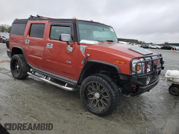 2003 Hummer H2 with VIN 5GRGN23U33H136931, listed as a Copart auction lot 80671794 with 127,137 mi miles and Salvage Title. Bid and sale history available at carsss.com. Image 4.