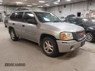 2006 GMC Envoy SLE with VIN 1GKDT13S662351668, listed as a IAAI auction lot 41263356 with 209,106 mi miles. Bid and sale history available at carsss.com. Image 1.