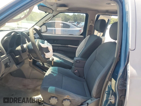2003 Nissan Frontier XE with VIN 1N6ED27T23C456197, listed as a Copart auction lot 57393515 with 181,596 mi miles and Salvage title. Bid and sale history available at DreamBid. Image 7.