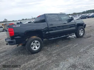 2017 Chevrolet Silverado 1500 LT with VIN 3GCUKREC9HG374973, listed as a IAAI auction lot 41423560 with 141,661 mi miles. Bid and sale history available at carsss.com. Image 4.