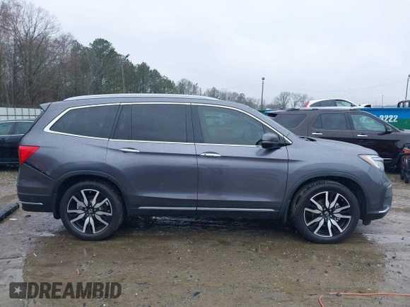 2021 Honda Pilot Touring 8-Passenger with VIN 5FNYF5H9XMB014190, listed as a IAAI auction lot 41749586 with 67,602 mi miles and . Bid and sale history available at DreamBid. Image 14.