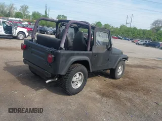 1999 Jeep Wrangler SE z VIN 1J4FY29P3XP469786, wystawiony jako IAAI lot #42131018 z przebiegiem 130 918 mil mil oraz . Historia ofert i sprzedaży dostępna na DreamBid. Obrazek 4.