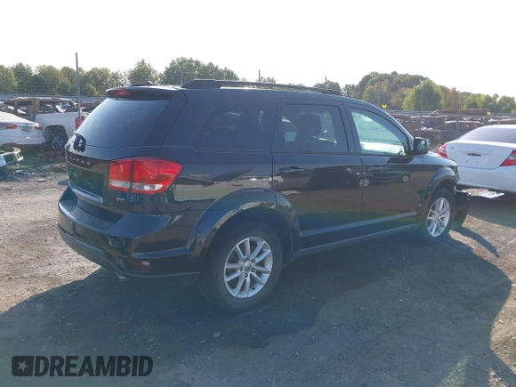 2013 Dodge Journey SXT with VIN 3C4PDCBG7DT710844, listed as a IAAI auction lot 40582910 with 136,741 mi miles and . Bid and sale history available at DreamBid. Image 4.