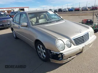 2002 Mercedes-Benz E-Class with VIN WDBJF65J92B479841, listed as a IAAI auction lot 41471955 with 203,527 mi miles. Bid and sale history available at carsss.com. Image 1.