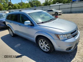 2013 Dodge Journey Crew with VIN 3C4PDCDG5DT599840, listed as a Copart auction lot 62542795 with 102,235 mi miles and Salvage title. Bid and sale history available at DreamBid. Image 4.