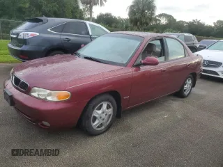 1999 Daewoo Nubira CDX z VIN KLAJB52Z5XK256700, wystawiony jako Copart lot #75085934 z przebiegiem Nie podano mil oraz Szkody całkowita. Historia ofert i sprzedaży dostępna na DreamBid. Obrazek 1.