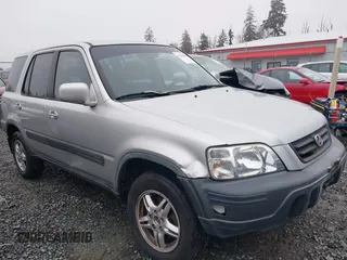1999 Honda CR-V EX with VIN JHLRD1866XC033865, listed as a IAAI auction lot 41219896 with 142,396 mi miles. Bid and sale history available at carsss.com. Image 6.