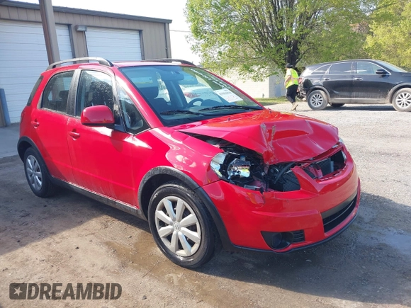 2010 Suzuki SX4 with VIN JS2YB5A34A6301801, listed as a IAAI auction lot 41884838 with 124,381 mi miles. Bid and sale history available at carsss.com. Image 1.