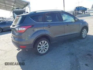 2018 Ford Escape Titanium with VIN 1FMCU0J98JUA03474, listed as a IAAI auction lot 37677880 with 106,423 mi miles and . Bid and sale history available at DreamBid. Image 4.
