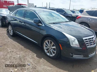 2014 Cadillac XTS Luxury z VIN 2G61M5S31E9308419, wystawiony jako IAAI lot #42128868 z przebiegiem 111 492 mil mil oraz . Historia ofert i sprzedaży dostępna na DreamBid. Obrazek 1.